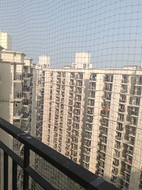 Pigeon net on a corner balcony by Quality Anti Bird Net Services