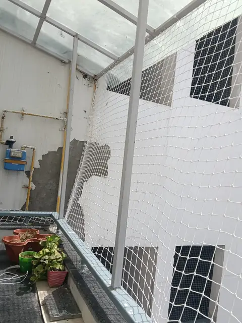 Utility area netted up to the roof by Quality Anti Bird Net Services