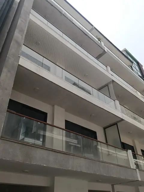 Building facade with balcony net by Quality Anti Bird Net Services