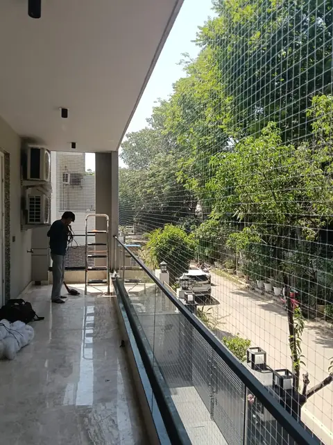 Installation in progress, large balcony by Quality Anti Bird Net Services