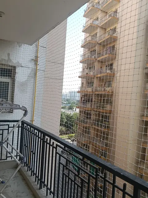 Pigeon net between two towers by Quality Anti Bird Net Services