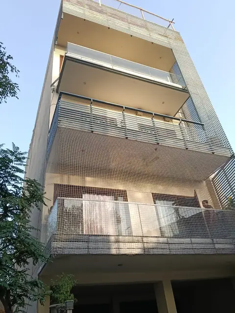 Balcony net seen from the street by Quality Anti Bird Net Services
